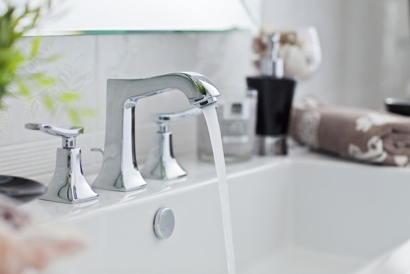 Add a point-of-use tankless heater to deal with new efficiency standards